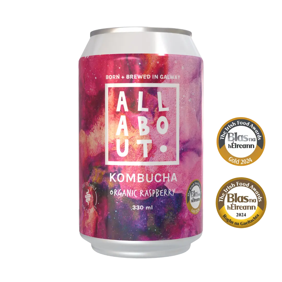 A 330 ml can of All About Organic Raspberry Kombucha. The can is shown alongside two gold Irish Food Awards from Blas na hEireann.