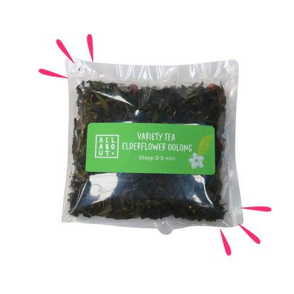 All About Kombucha variety tea pouch labeled Elderflower Oolong in a clear 3–5 minute steeping pack with green label, showing loose tea leaves and floral ingredients


