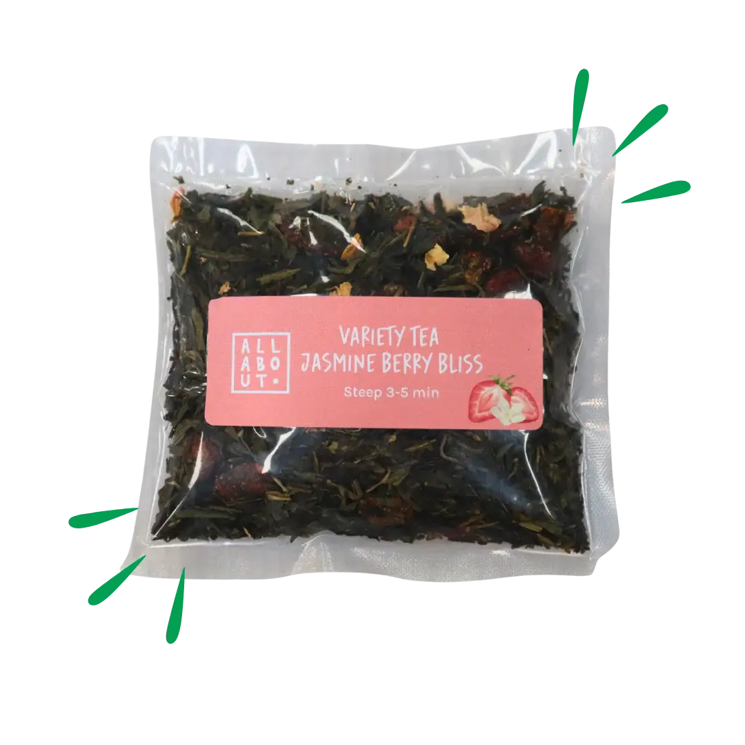 All About Kombucha variety tea pouch labeled Jasmine Berry Bliss in a clear 3–5 minute steeping pack with a pink label, containing loose tea leaves and dried berries.
