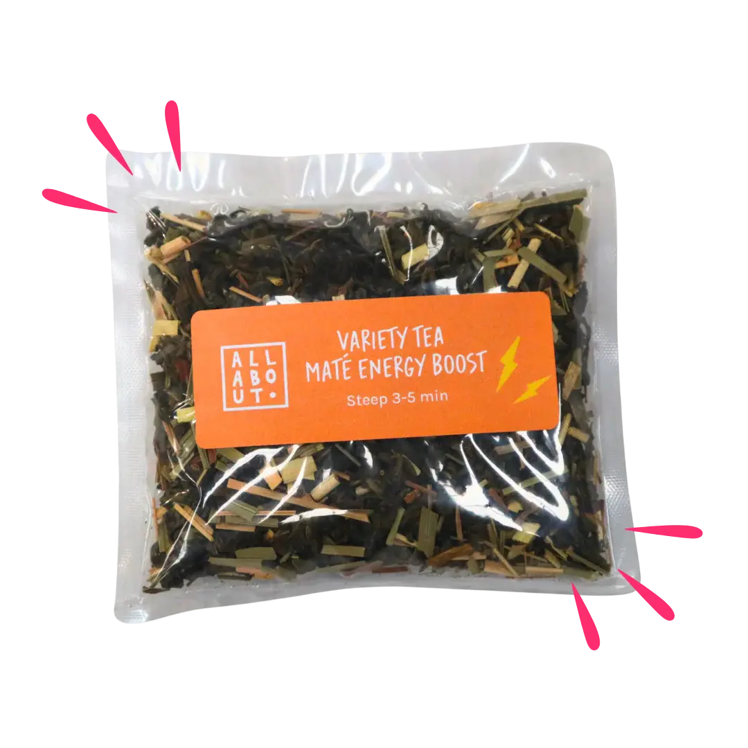 All About Kombucha variety tea pouch labeled Maté Energy Boost in a clear steeping pack with an orange label, featuring loose leaf tea and lightning bolt icons.
