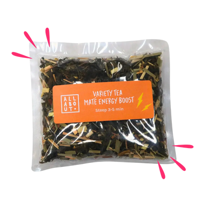 All About Kombucha variety tea pouch labeled Maté Energy Boost in a clear steeping pack with an orange label, featuring loose leaf tea and lightning bolt icons.