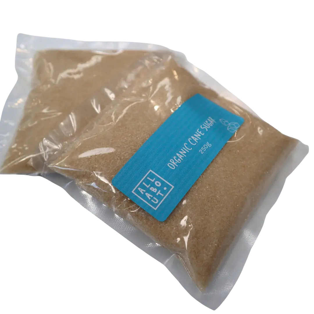 All About Kombucha 250g pouch of organic cane sugar in clear vacuum-sealed packaging with a blue label, ideal for kombucha brewing.