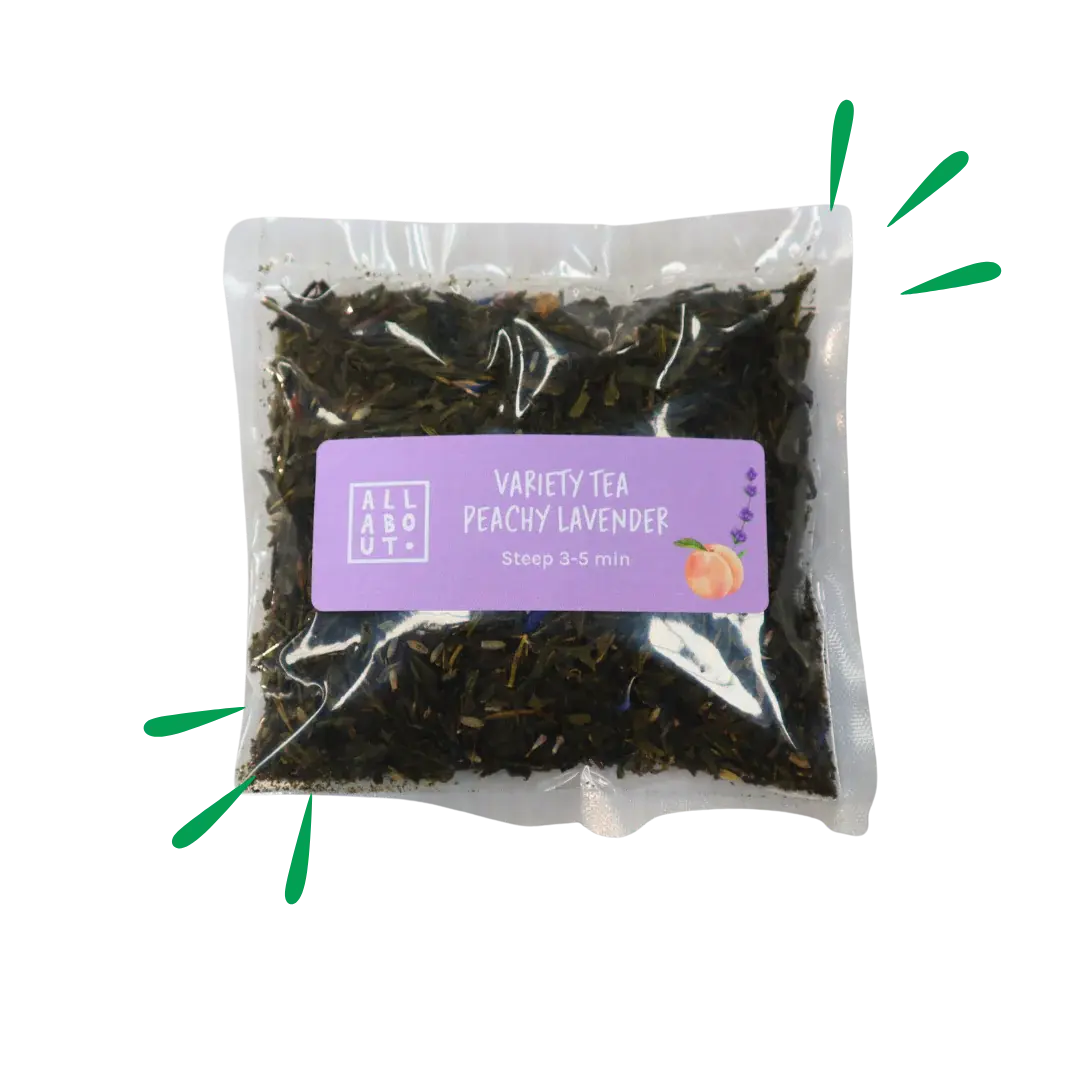All About Kombucha variety tea pouch labeled Peachy Lavender in a clear 3–5 minute steeping pack with purple label and illustrated peach