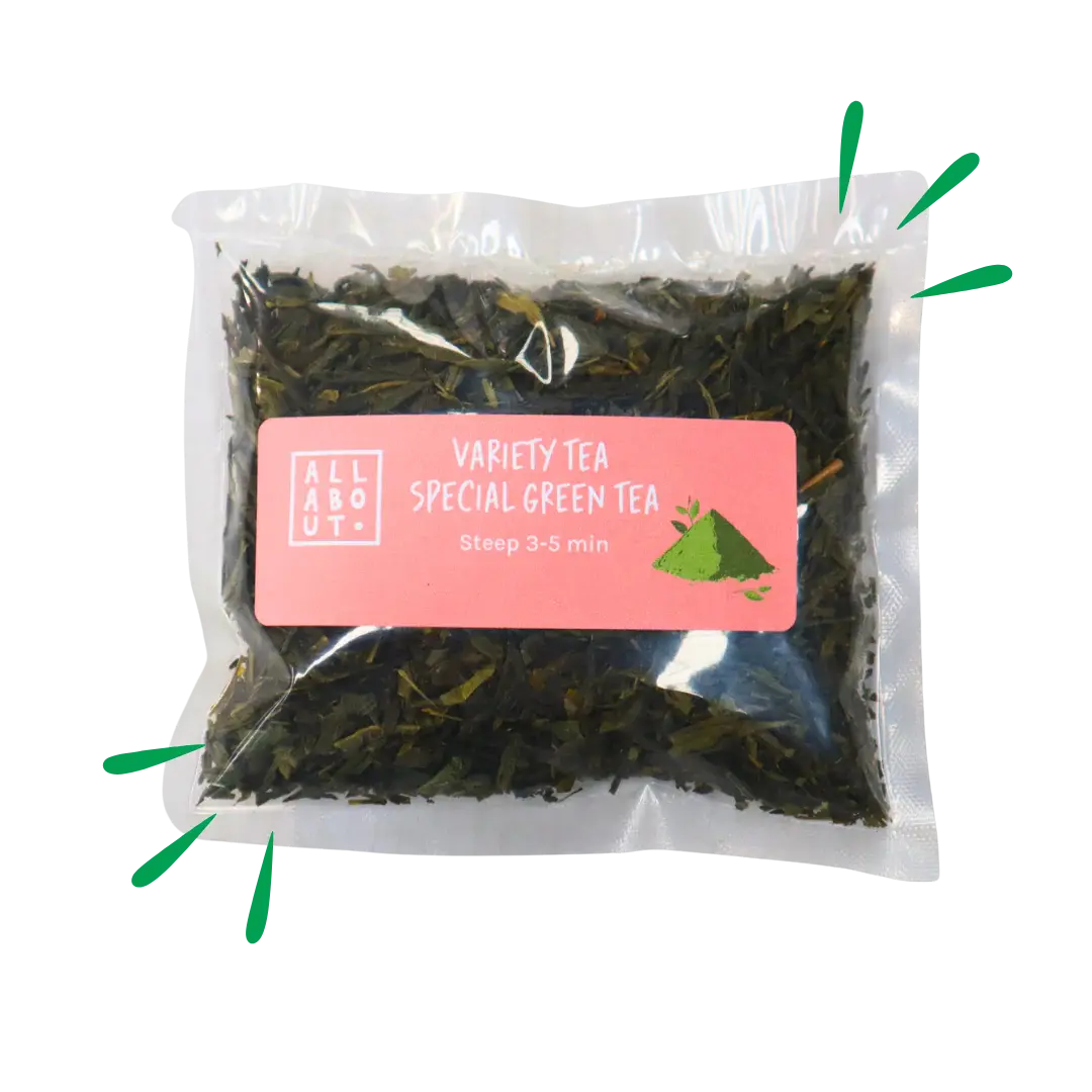 All About Kombucha variety tea pouch labeled Special Green Tea in a clear pack with pink label, steep time 3–5 minutes, showing loose green tea leaves.