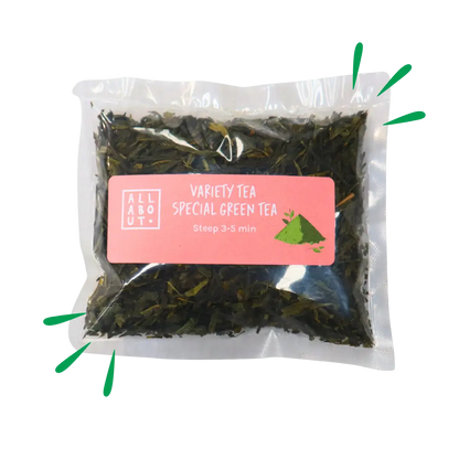 All About Kombucha variety tea pouch labeled Special Green Tea in a clear pack with pink label, steep time 3–5 minutes, showing loose green tea leaves.